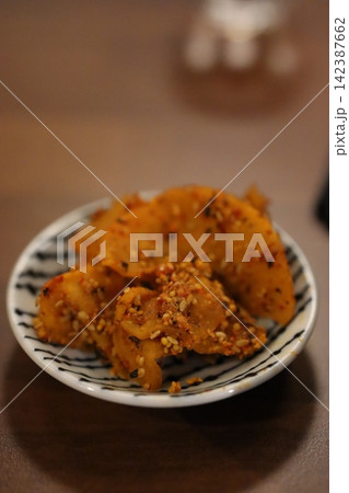 Sesame-Topped Spicy Potato Chips in Ceramic Bowl Sesame-Topped Spicy Potato Chips in Ceramic Bowl 142387662