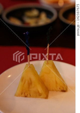 Pineapple Skewers on White Plate 142387675