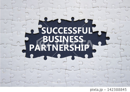 Successful Business Partnership symbol. White puzzle with words Successful Business Partnership. Beautiful deep blue background. Business concept. Copy space. Successful Business Partnership symbol. White puzzle with words Successful Business Partnership. Beautiful deep blue background. Business concept. Copy space. 142388845