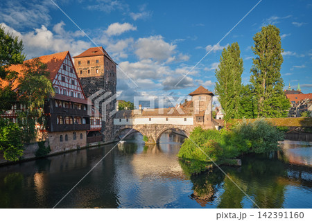 Bavaria Nuremberg city houses and Henkersteg bridge over the river sunset Bavaria Nuremberg city houses and Henkersteg bridge over the river sunset 142391160