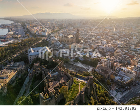 Aerial view of Malaga cityscape at sunset with the Alcazaba Aerial view of Malaga cityscape at sunset with the Alcazaba 142391292