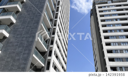Modern apartment buildings against blue sky Modern apartment buildings against blue sky 142391938