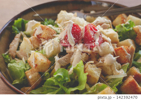 classic Caesar salad, close-up, natural light, selective focus, horizontal, classic Caesar salad, close-up, natural light, selective focus, horizontal, 142392470