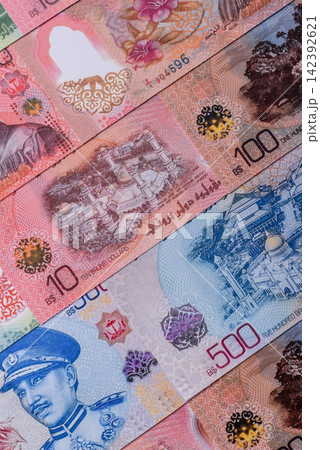 Brunei paper money, dollar banknotes and sen coins as currency for exchange or travel. Brunei money 142392621