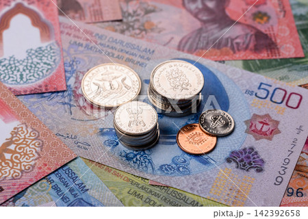 Brunei paper money, dollar banknotes and sen coins as currency for exchange or travel. Brunei money 142392658