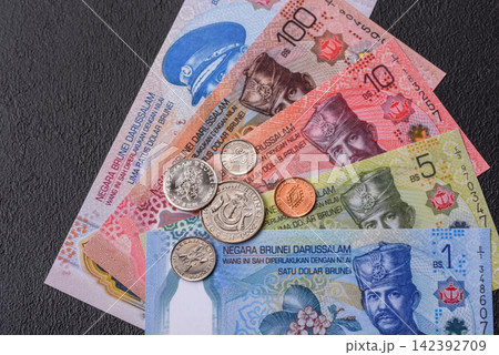 Brunei paper money, dollar banknotes and sen coins as currency for exchange or travel. Brunei money 142392709