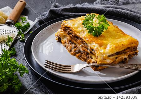 Meat lasagna portion with minced beef, cheese Meat lasagna portion with minced beef, cheese 142393039