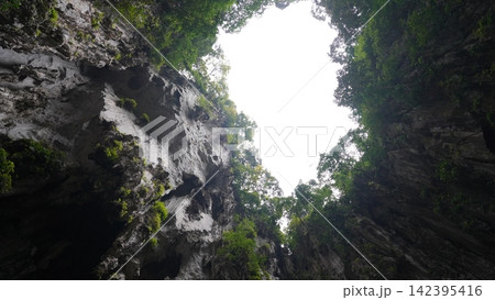 Cave Opening Skyward Glimpse of Sunlight Nature Scenery 142395416