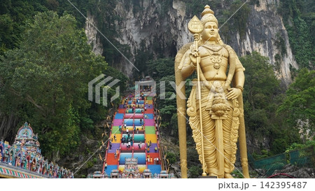 Batu Caves Malaysia Golden Statue and Colorful Stairway Batu Caves Malaysia Golden Statue and Colorful Stairway 142395487