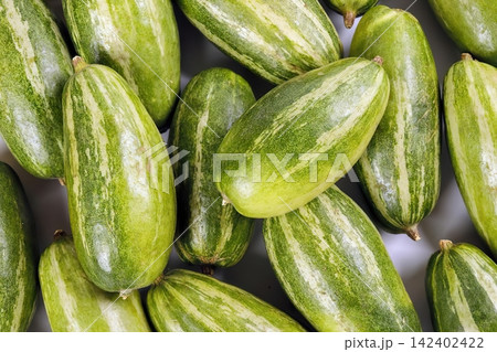 Close-up of fresh green starfruit on dark background 142402422