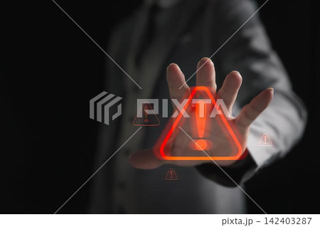 Person pointing at glowing warning sign with exclamation mark 142403287