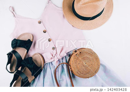 Sport shoes hat and wooden log on white background 142403428
