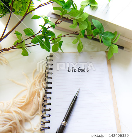 Notebook with my life goals inspiring new beginnings and future life planning. Goal Life Wellness Concept. Notebook with my life goals inspiring new beginnings and future life planning. Goal Life Wellness Concept. 142406329