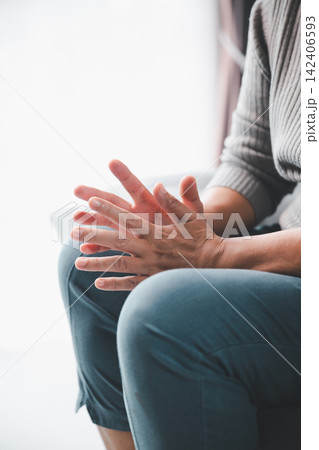 Close-up of an adult using expressive hand gestures during a personal conversation, counseling session, or therapy consultation, representing communication, emotional support, advice, 142406593