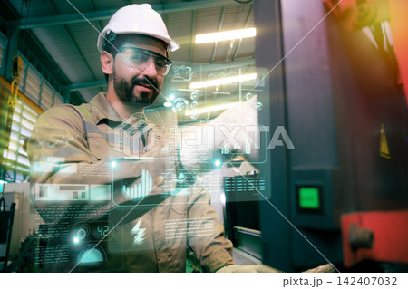 Engineers and workers work in the factory. 142407032