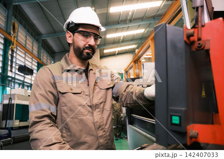 Engineers and workers work in the factory. Engineers and workers work in the factory. 142407033