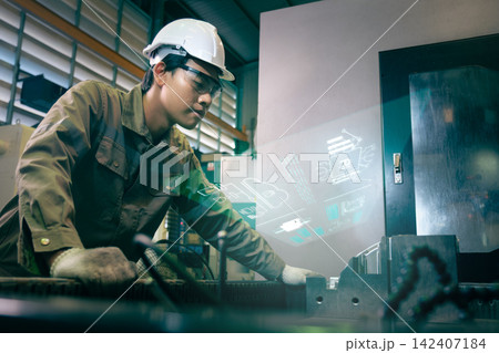Engineers and workers work in the factory. Engineers and workers work in the factory. 142407184