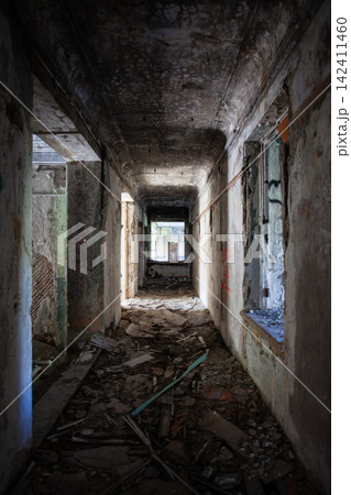 Abandoned Soviet-era Palace of Culture in the former mining settlement of Kukisvumchorr near Kirovsk, Murmansk Region, Russia. The decaying cultural building stands beneath the Khibiny Mountains, surr 142411460