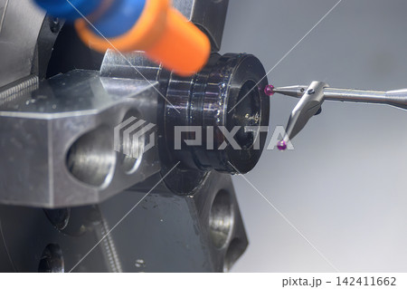 Quality control inspection on CNC lathe machine using modular probe to measure metal ring parts Quality control inspection on CNC lathe machine using modular probe to measure metal ring parts 142411662
