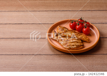 Grilled chicken steak seasoned with salt and spices. Chicken steak Grilled chicken steak seasoned with salt and spices. Chicken steak 142412346