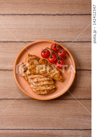 Grilled chicken steak seasoned with salt and spices. Chicken steak Grilled chicken steak seasoned with salt and spices. Chicken steak 142412347