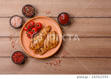 Grilled chicken steak seasoned with salt and spices. Chicken steak Grilled chicken steak seasoned with salt and spices. Chicken steak 142412354