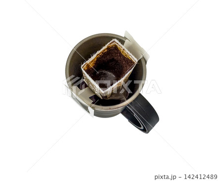 Coffee brewing process with drip bag in black mug on white background 142412489