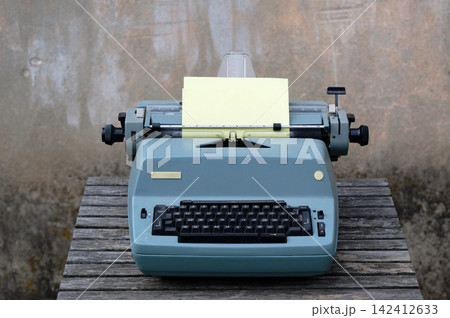 Typewriter with paper sheet Typewriter with paper sheet 142412633