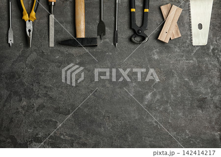 Flat lay composition with carpenter's tools on grey background. Space for text Flat lay composition with carpenter's tools on grey background. Space for text 142414217