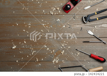 Flat lay composition with carpenter's tools on wooden background. Space for text Flat lay composition with carpenter's tools on wooden background. Space for text 142414221