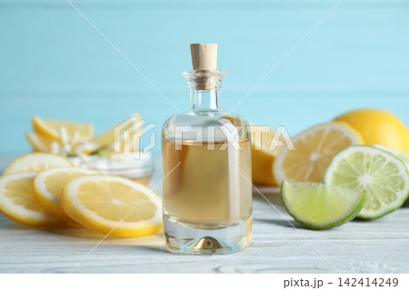 Citrus essential oil on white wooden table Citrus essential oil on white wooden table 142414249