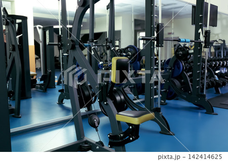 Interior of modern gym with new equipment 142414625