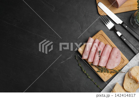 Tasty ham served on black table, flat lay. Space for text Tasty ham served on black table, flat lay. Space for text 142414817