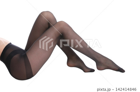 Woman wearing black tights isolated on white, closeup of legs Woman wearing black tights isolated on white, closeup of legs 142414846
