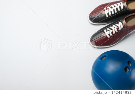 Bowling ball and shoes on white background, above view Bowling ball and shoes on white background, above view 142414952