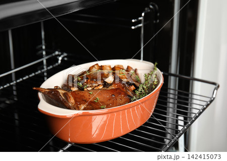 Delicious roasted ribs with thyme in oven Delicious roasted ribs with thyme in oven 142415073