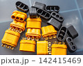 Shiny gold-plated MR60 power connectors, both male and female, for 3-phase electric motors and e-transport, macro shot 142415469