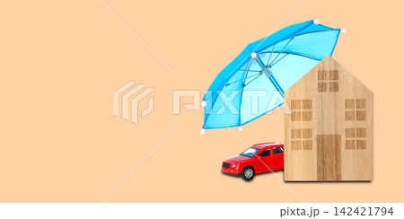 Insurance. House and car placed under an umbrella on a simple background Insurance. House and car placed under an umbrella on a simple background 142421794