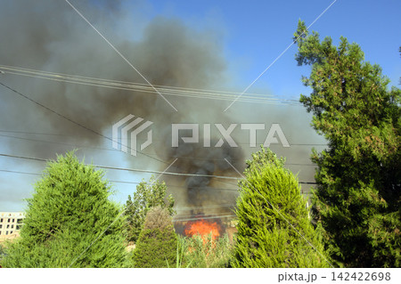 fire flames on a rural area fire flames on a rural area 142422698