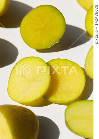 Raw potatoes on a white background. Raw potatoes on a white background. 142426028