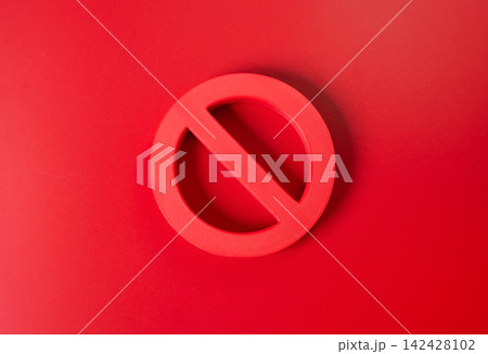 Prohibition symbol on a red background. Sanctions and restrictions concept. Cancellation, refusal and a total ban represent blocked access and strict limitations. Prohibition symbol on a red background. Sanctions and restrictions concept. Cancellation, refusal and a total ban represent blocked access and strict limitations. 142428102