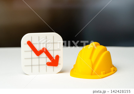 Declining chart and construction helmet. Slower construction activity, lower prices and reduced costs. Market downturn affects development projects, investment and the building industry. Declining chart and construction helmet. Slower construction activity, lower prices and reduced costs. Market downturn affects development projects, investment and the building industry. 142428155