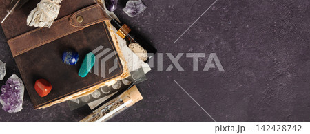 Leather Journal with Crystals, Sage, and Healing Stones on Dark Background Leather Journal with Crystals, Sage, and Healing Stones on Dark Background 142428742