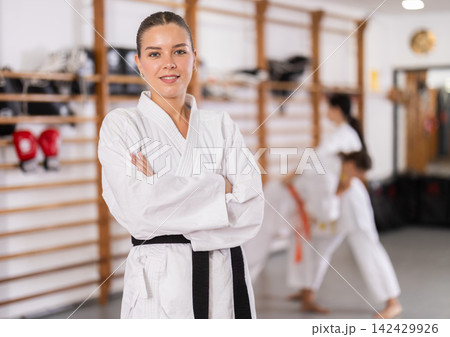 Young girl wearing kimono standing in sports hall 142429926