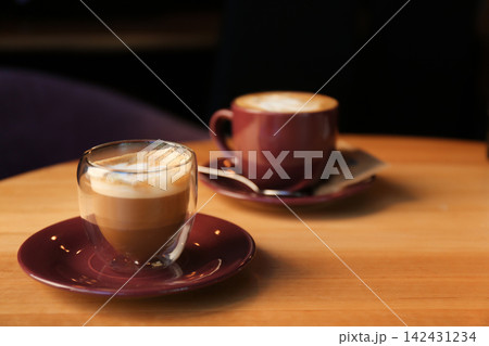 Aromatic coffee on wooden table in cafe. Space for text 142431234