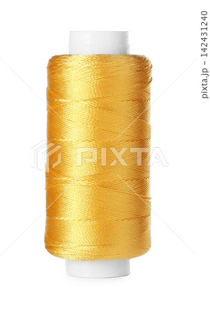 Spool of yellow sewing thread isolated on white Spool of yellow sewing thread isolated on white 142431240
