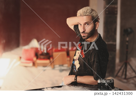 Person exuding confidence through lively accessories and broad smile Person exuding confidence through lively accessories and broad smile 142431300