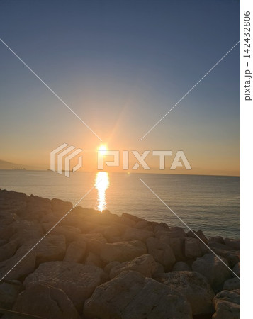 Panorama of a beautiful sunrise over the sea off the coast of Naples, Italy 142432806