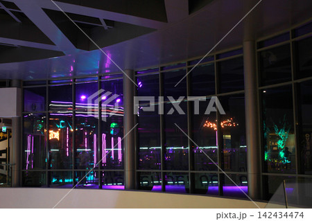 Empty modern interior with neon reflections at night Empty modern interior with neon reflections at night 142434474