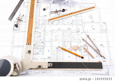 Architectural blueprints with tools and ruler on desk 142435033